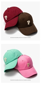 Detailed embroidery of letter P on cotton canvas baseball caps in multiple colors