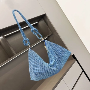 Detailed view of sky blue rhinestone hobo bag with knotted strap and crystal texture