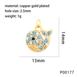 Gold-plated copper whale pendant with blue crystals measuring 14mm by 13mm