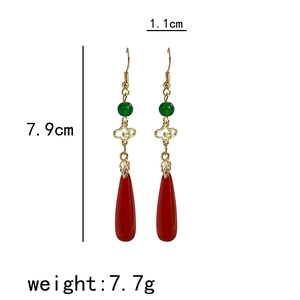 Detail shot of Chinese cloud earrings with 7.9cm length and red teardrop pendant