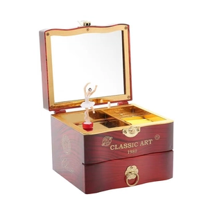 Classic wooden music box with dancing ballerina, jewelry storage, and golden lock detail