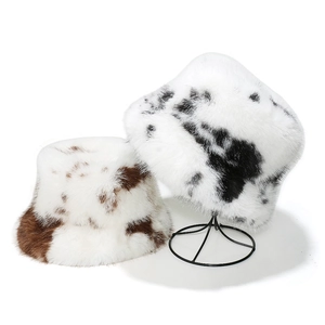 Plush faux fur cow print bucket hats for women in black and brown winter warmth