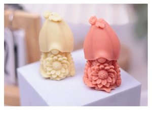 Detailed view of gnome silicone molds featuring decorative flowers for DIY candle making