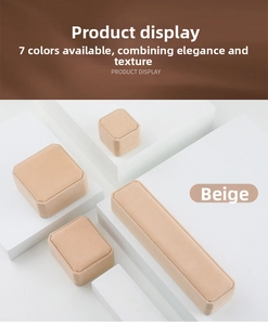 Detail of four-piece beige velvet jewelry gift box set on display stands
