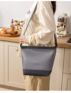 Adjustable shoulder strap detail on insulated lunch bag for outdoor picnic use