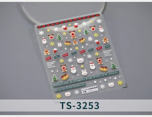 Macro shot of 5D embossed Christmas nail stickers featuring Santa and snowflake motifs