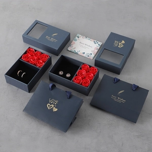 Navy blue jewelry gift box with six red roses, matching paper bag and greeting card set