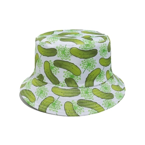 Detailed view of white bucket hat featuring green cucumber and floral print patterns