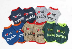 Flat lay of multiple colorful dog sweatshirts with I Love Mommy and Daddy prints