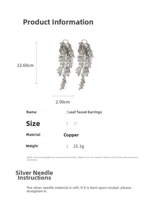 Macro detail showing dimensions of silver leaf tassel earrings with layered metal petals