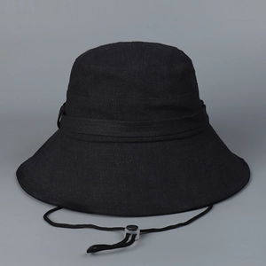 Detail of black cotton linen sun hat with wide brim and adjustable chin strap