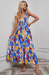 Detail of the layered bohemian floral print dress with pleated bodice and tie straps