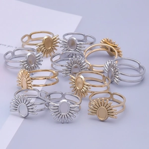Detailed view of adjustable sunburst rings with oval faces in gold and silver finishes