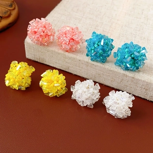 Cluster stud earrings featuring colorful beads and crystals on linen and leather base