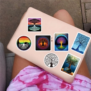Detailed view of colorful Tree of Life stickers applied on a pink laptop cover