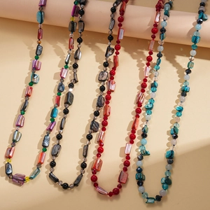 Long beaded necklace set with shell accents and faceted crystals in five vibrant colors