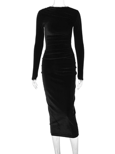 Detail of elegant black velvet texture and slimming ruched fabric on the dress