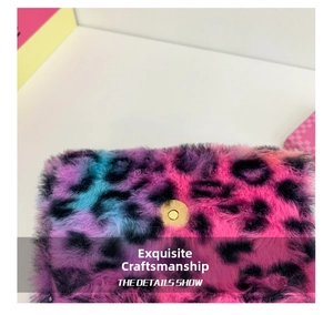 Detailed macro view of colorful leopard plush fabric and gold magnetic closure on bag