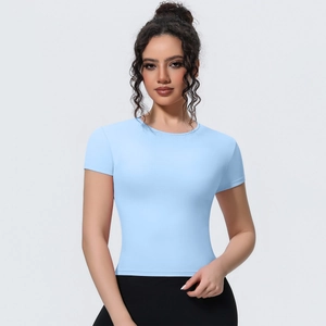 Detail of light blue slim fit short sleeve yoga top with breathable athletic fabric