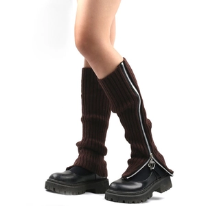 Close-up of brown knitted leg warmers featuring a stylish silver metal zipper detail