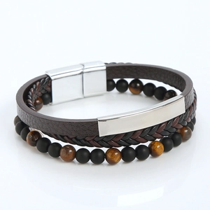 Detail of multi-layer leather bracelet with tiger eye beads and silver magnetic clasp