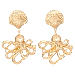 Detailed close-up of golden sea shell and octopus pendant earrings with textured surface