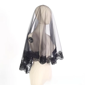 Detailed view of single layer black wedding veil with intricate mandala floral lace trim