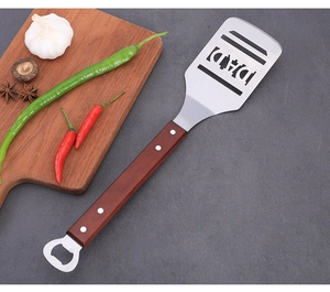 Stainless steel BBQ spatula with wooden handle and bottle opener, DAD cutout design for grill.