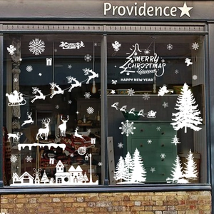 White Christmas window static stickers featuring Santa, reindeer, and snowflakes for glass decor