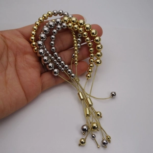 Adjustable gold and silver ball bead bracelets set with minimalist slide closure