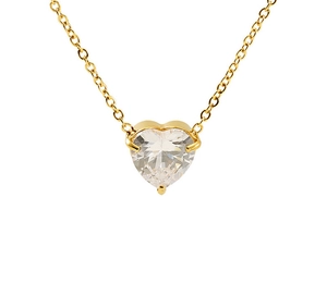 Detail of gold heart pendant necklace featuring a sparkling heart-cut cubic zirconia stone