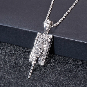 Detailed close-up of a silver punk tank pendant on a stainless steel twist chain