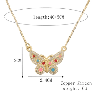 Detail of gold-plated butterfly pendant with colorful zircons, size and weight specs shown