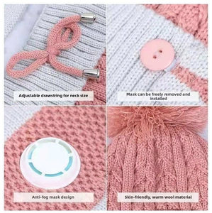 Detailed close-up of pink knit hat with adjustable drawstrings and a white breathing valve