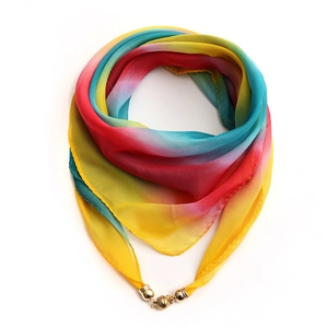 Detail of gradient rainbow silk scarf with decorative gold magnetic ball buckle