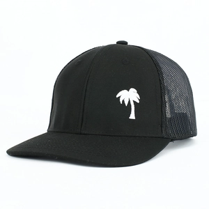 Close-up of black trucker hat featuring white palm tree embroidery and mesh back