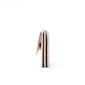 Side view of light pink leather wallet showing triple accordion compartments and silver snap
