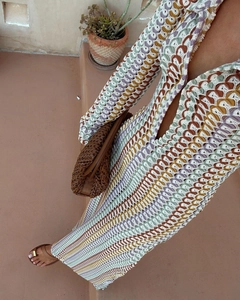Detailed view of bohemian crochet knit maxi dress with multicolored wave pattern texture