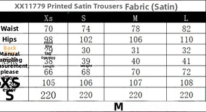 Detailed size chart for satin printed high-waist trousers showing XS to L measurements