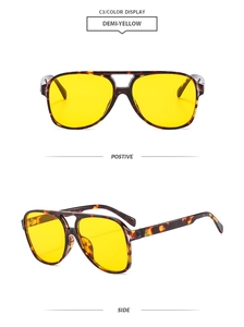 Detail view of classic aviator sunglasses featuring demi-tortoise frames and yellow lenses