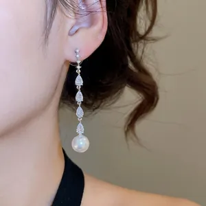 Elegant silver drop earrings with pear-shaped zircon tassels and round white pearls