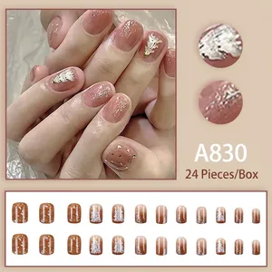 Christmas theme press-on nails set with 24 pieces featuring star and tree designs