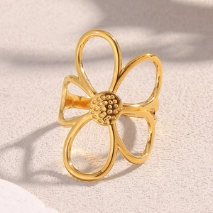 Detailed macro shot of vintage 18K gold-plated stainless steel hollow floral open ring