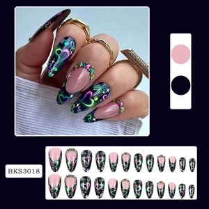 Macro detail of long stiletto press-on nails with neon hearts and rhinestones, set BKS3018