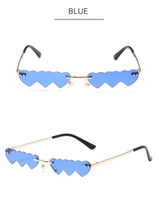 Detail view of heart-shaped blue rimless sunglasses with dual-tone metal temples