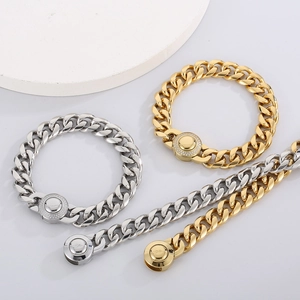 Detail of gold and silver cuban link bracelet with sparkling diamond magnetic clasp