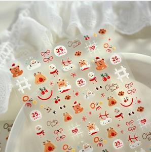 Detail of 3D embossed Christmas nail stickers featuring bears, elk and snowmen