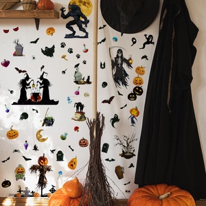 Halloween wall decals featuring pumpkins, ghosts, and bats on a living room wall