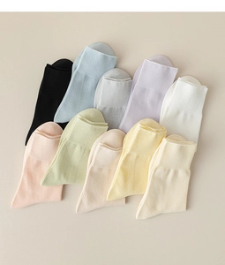 Detailed view of women's soft cotton thin mid-tube socks in various pastel colors neatly arranged.