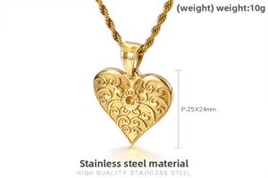 Macro shot of gold stainless steel heart pendant with sunburst engraving and twist chain
